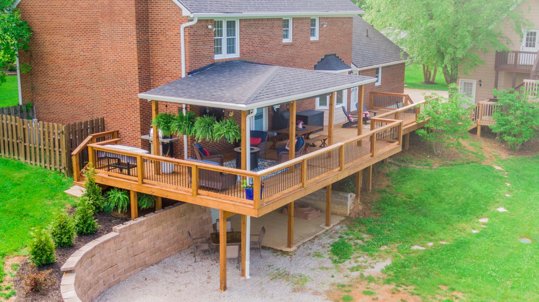 Aerial view of covered deck on brick home — Central Kentucky
