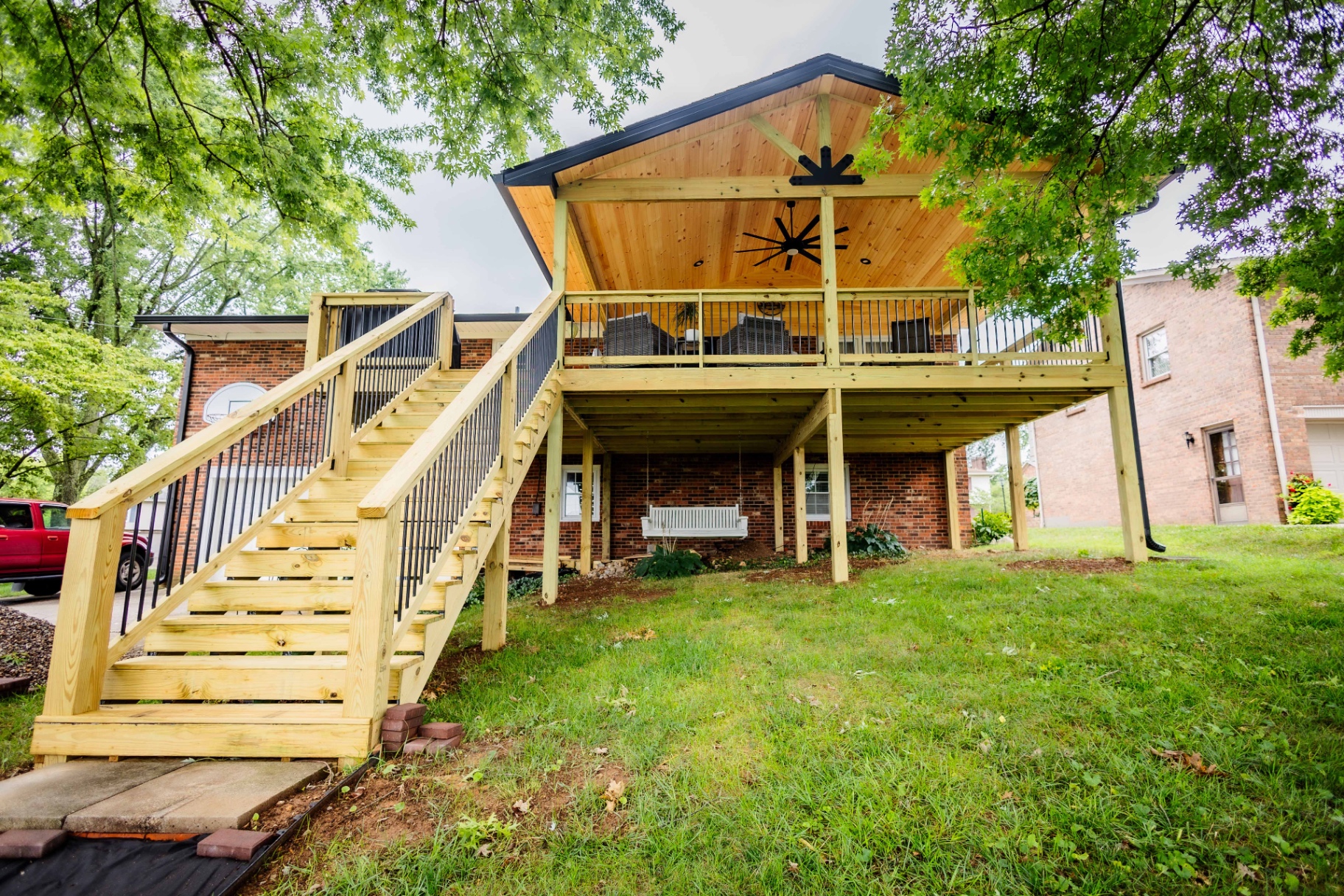 Elevated gable-roof covered deck with staircase — Central Kentucky